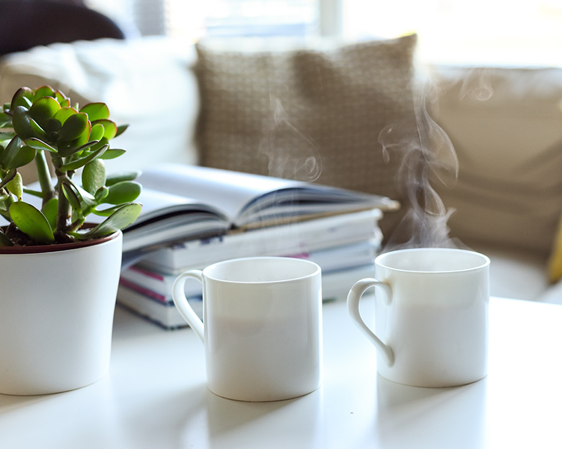 Two mugs on a table with pillow for individual therapy